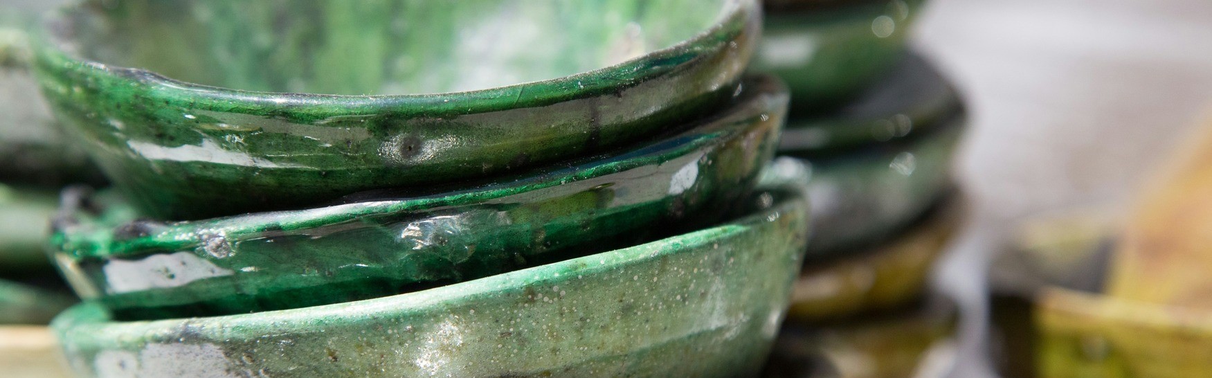 a background picture with stacks of pottery bowls